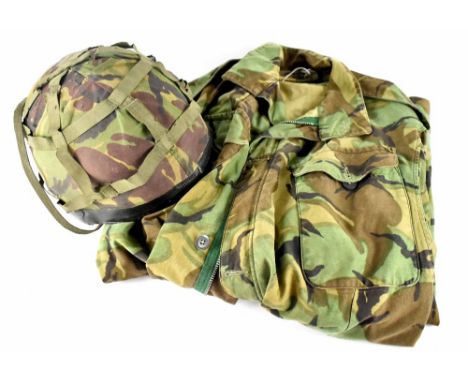 A British Army post-war camouflage jacket, size large and a helmet with camouflage cover (2).