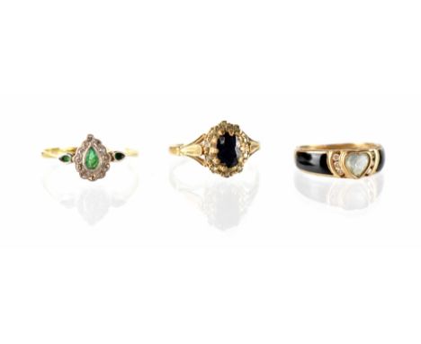 Three 9ct gold fashion rings to include an emerald and diamond heart ring with two tiny emeralds to the shoulders, size R, a 