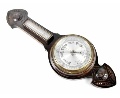 A carved oak wall-hanging barometer, length 65cm.