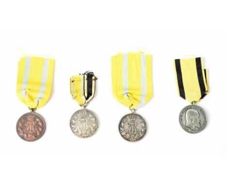 Two German Silver Class and a Bronze Class Friedrich August Medals and a Wurttemberg Service Medal (4).