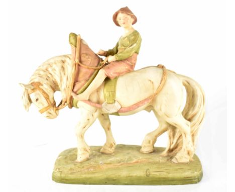 A Royal Dux figure of a boy riding a heavy horse, impressed number 1693 to base and impressed marks, height 36cm. CONDITION R