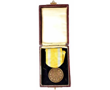 A cased Friedrich August Bronze Class Merit Medal.