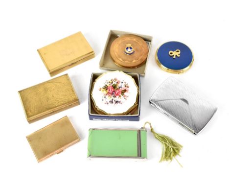 A quantity of vintage compacts to include novelty and musical examples.
