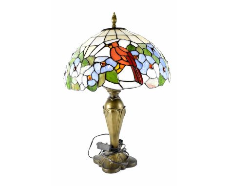 A Tiffany-style table lamp, the domed shade with cardinal birds and blue flowers, on an Art Nouveau style base, height 61cm.