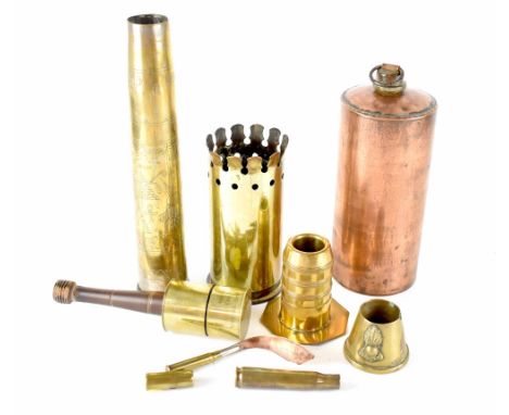 A collection of trench art to include two artillery shells, one WWII engraved with Middle Eastern/Egyptian scenes, the other 