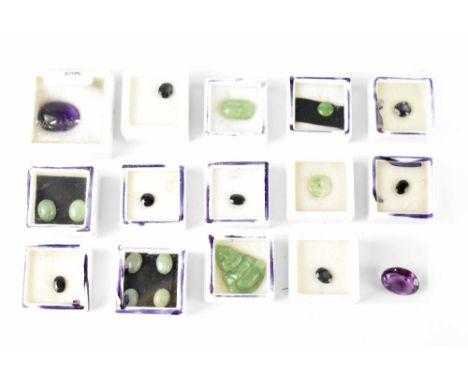 A quantity of loose gemstones to include jade and sapphire examples.