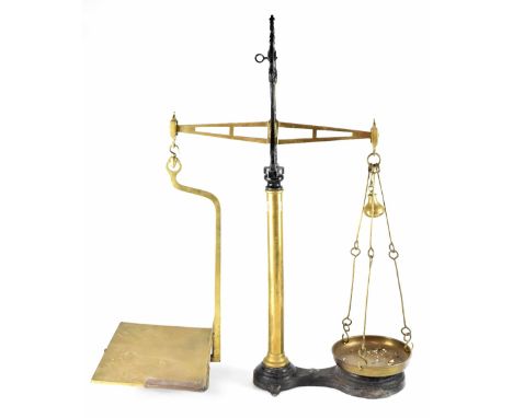 A vintage black cast iron and brass set of banking scales, height 88cm.