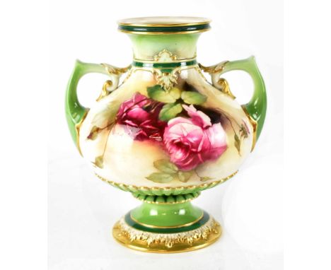 A Royal Worcester twin-handled vase of bulbous form painted with roses on a cream ground within green and gilt borders, signe