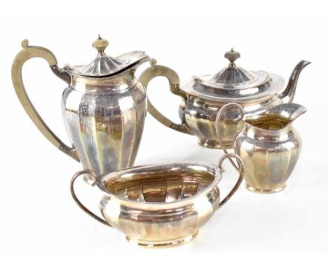 An Elizabeth II hallmarked silver four-piece tea service comprising teapot, hot water pot, sucrier and milk jug, Barker Broth