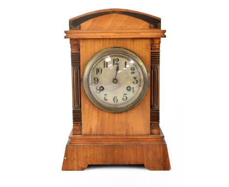 Junghens; an early 20th century mahogany cased mantel clock with applied metal decoration, the silvered dial set with Arabic 