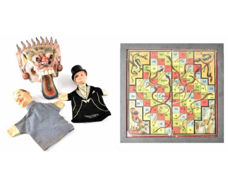 An Oriental wooden carved dragon mask, a vintage Charlie McCarthy glove puppet, one other c1950s rubber head glove puppet and