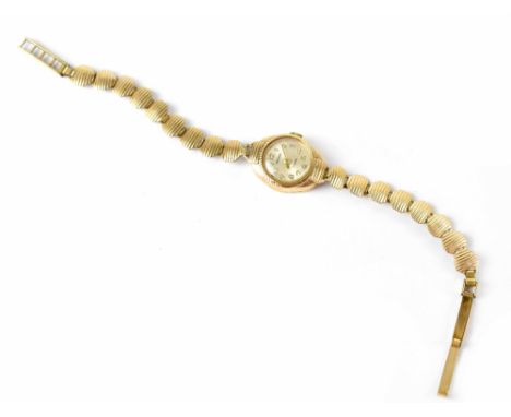 Sekonda; a ladies' vintage 9ct gold wristwatch on later rolled gold strap.