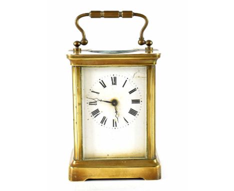 A brass-cased carriage clock, the enamelled dial set with Roman numerals, in corniche case, movement stamped 'R &amp; Co Made