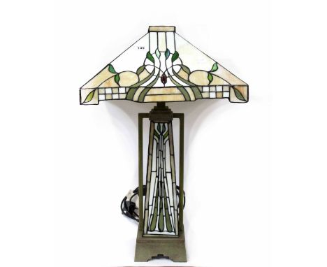 A Tiffany-style table lamp with square shade with Art Nouveau foliate motifs in green, brown and cream, on a square base, hei