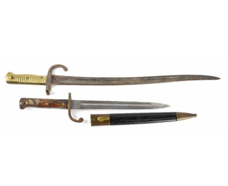 Two WWI bayonets, one by Weyersberg Kirschbaum &amp; Co. Solingen German bayonet with brass and leather scabbard and a French