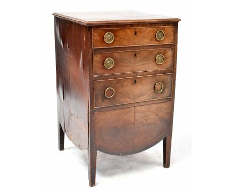 A George III mahogany chest of drawers/commode, the front with three graduated drawers, the reverse with cupboard doors and s