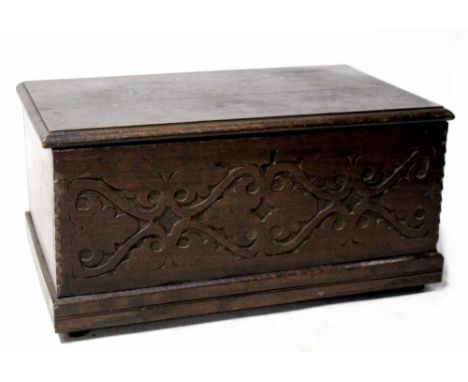 An 18th century oak carved Bible box with wrought iron hinges and lock, carved Celtic pattern to the front panel, height 30cm