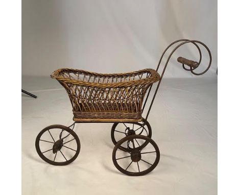 A wicker dolls' pram.

NOTE: ITEM IS LOCATED IN THE L34 POSTCODE AREA. THE SUCCESSFUL BIDDER WILL BE ABLE TO ARRANGE COLLECTI