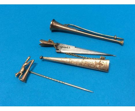 A '9ct' hunting horn brooch, a fox and horn pin etc.