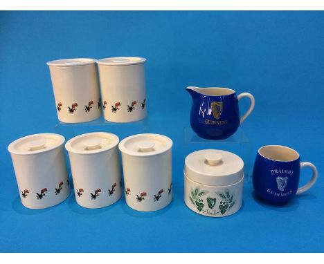 Six Carlton ware Guinness storage jars, a water jug and a mug