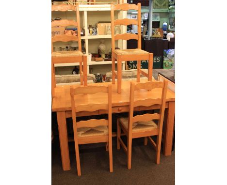 Rectangular kitchen table and four ladder back rush seated dining chairs