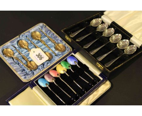 Three boxed sets of silver coffee spoons, one with coloured enamel