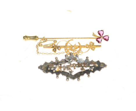 Gold stick pin, gold and silver brooches (3)