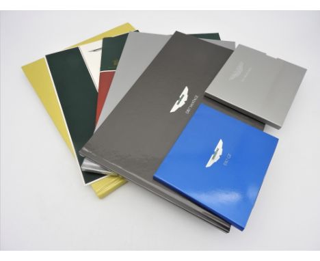 COLLECTION OF 1990S-2000S ASTON-MARTIN PROMOTIONAL MATERIAL  Contains:  V12 Vanquish brochure and CD-rom DB7 GT Press Informa