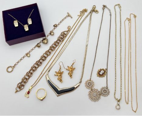 A collection of vintage gold tone costume jewellery. To include silver gilt bracelet, boxed necklace &amp; earring set and pe