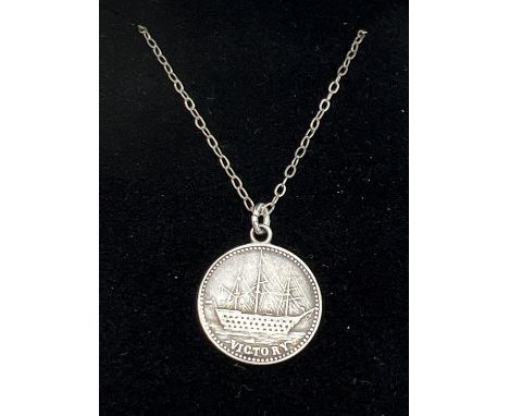 A boxed 18" silver chain with a HMS Victory coin like pendant. Chain stamped 925 to spring ring clasp. Pendant approx. 1.6cm 