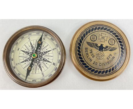 A replica German WWII screw top brass cased compass with engraved 20th Infantry Division detail to lid. Approx. 7.75cm diamet
