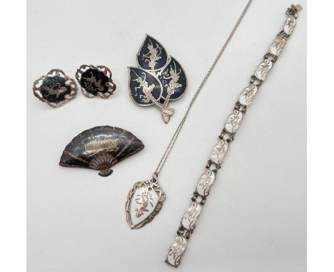 A collection of vintage Siam silver jewellery. A white enamelled pendant on an 18" fine belcher chain with matching 9 panel b