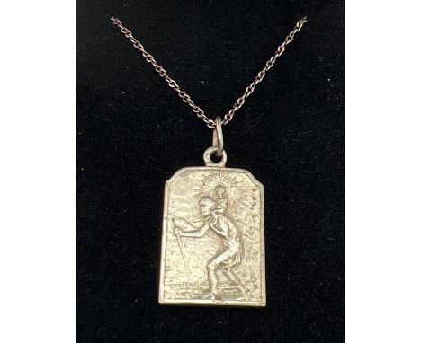 A vintage rectangular shaped double sided St. Christopher pendant on a 17" silver gilt chain. Chain stamped 925 to spring rin