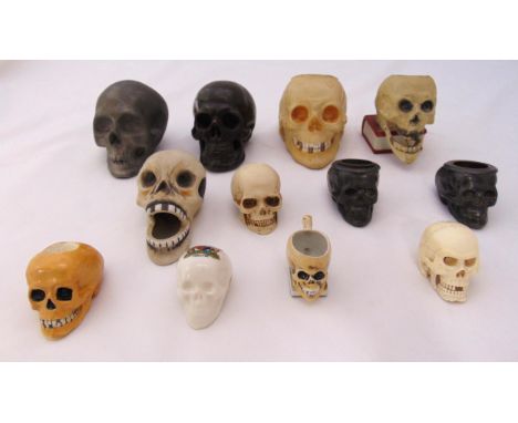 A quantity of porcelain, ceramic and metal miniature skulls (12)