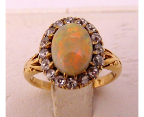 A yellow gold opal and diamond ring, approx total weight 3.1g