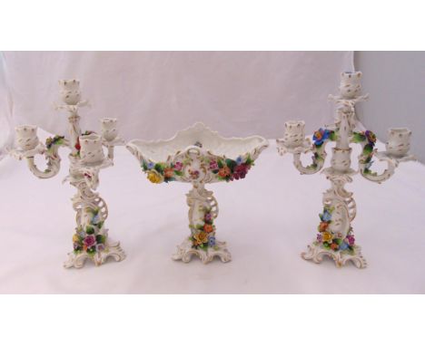 Sitzendorf 19th century four light candelabra with matching centre piece decorated with applied flowers and leaves on raised 