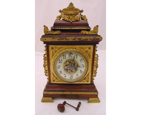 A 19th century mahogany and gilt metal bracket clock, the wooden case mounted with pierced metalwork, white enamel dial, Arab