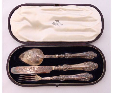 A cased Victorian hallmarked silver Christening set to include a knife, a fork and spoon, Birmingham 1854