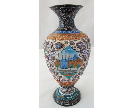 A Persian enamel and white metal baluster vase decorated with scenes of landscapes and mosques, the sides in relief decorated