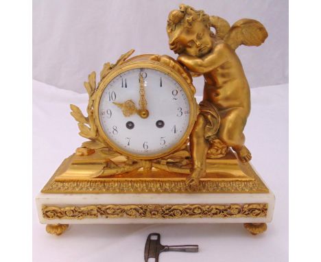 A French gilt metal and marble mantle clock, the white enamel dial, Arabic numerals, two train movement supported by a putti 