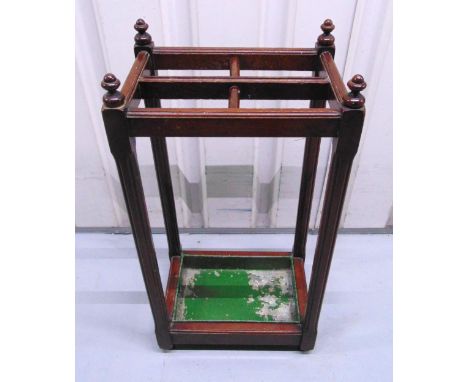 A mahogany rectangular umbrella and stick stand with detachable lead base, 69 x 35.5 x 25.5cm