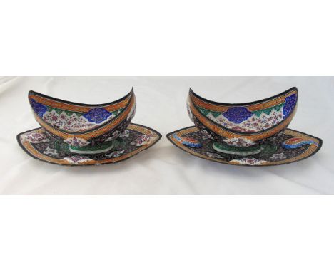 A pair of Persian enamel and white metal oval bowls on stands, decorated throughout with birds, flowers and leaves, 16 x 34cm