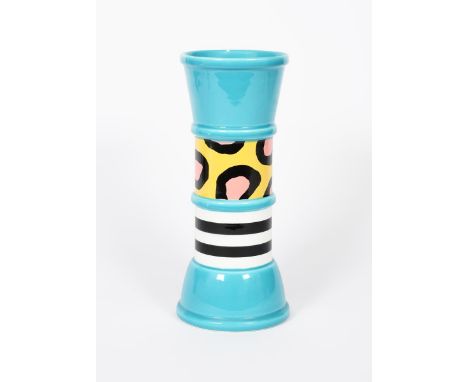 A Memphis Milano Carrot vase designed by Natalie Du Pasquier, made by Flavia, cylindrical knopped body with flaring foot and 
