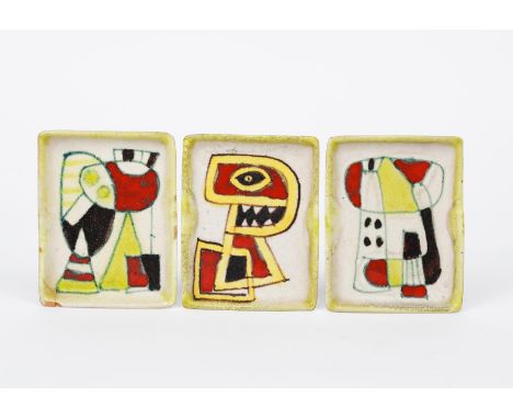 A Guido Gambone Pottery dish, rectangular form, painted with an abstract figure design in red, yellow and black on a white gr