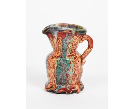 ‡Kate Malone MBE (born 1959) a Carnival Ware jug with fluted foot glazed in colours incised Kate Malone 12.5cm. high Provenan