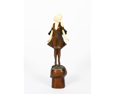 λ Professor Otto Poertzel (1876-1963) Champagne Girl, patinated bronze and ivory figure of a girl standing on a champagne cor