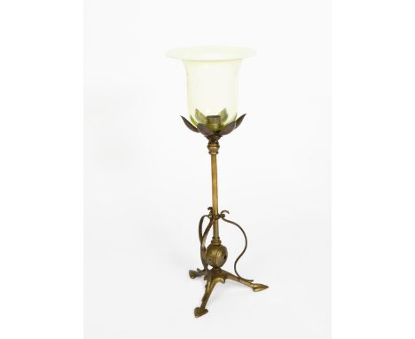 A brass and vaseline glass table lamp in the manner of WAS Benson,  tripod foot with heart-shaped feet, supporting cylindrica