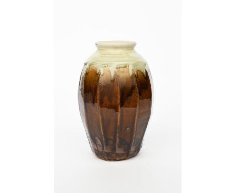 Richard Batterham (1936-2021) A cut-sided stoneware Lily jar,  with collar neck, covered with a streaked ash manganese glaze,
