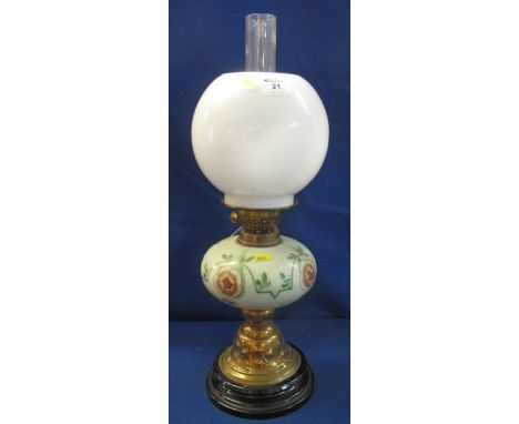 Early 20th Century brass double burner oil lamp with ceramic floral reservoir, brass pedestal and ceramic base, opaque shade 