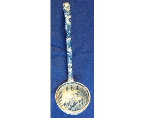 19th Century Staffordshire pottery blue and white transfer printed ladle decorated with flowers to the handle, the bowl with 